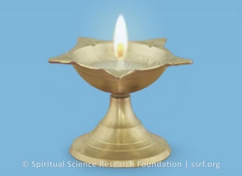 1. Lighting a ghee lamp or a sesame seed oil lamp